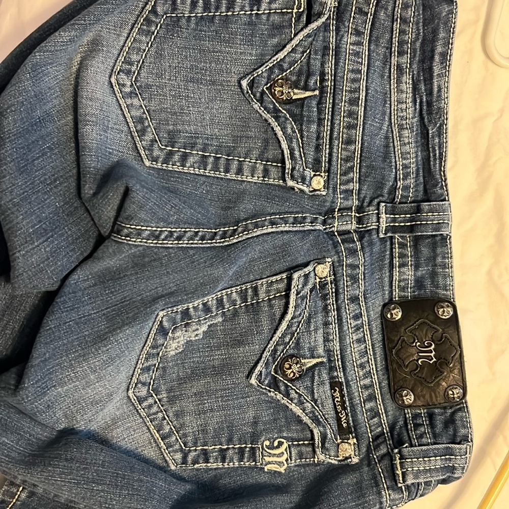 Miss Me Jeans.  Missing button cover.